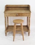 A late 19th/ early 20th century washstand with three quarter galleried top above a single drawer,