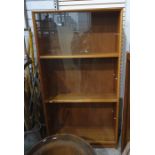 Twentieth century teak display cabinet, three banks of sliding glass doors, enclosing shelves, the