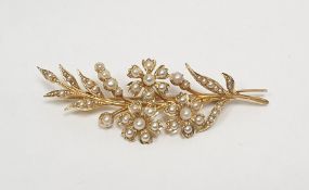 Antique gold-coloured metal and seedpearl floral spray brooch