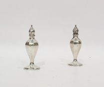 Pair continental sterling silver pepperettes, panelled and inverse baluster shape