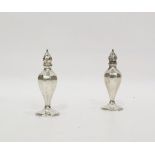 Pair continental sterling silver pepperettes, panelled and inverse baluster shape