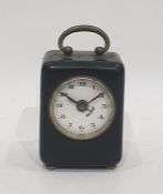 Small metal mounted alarm clock, or gun clock, square section 7 cm high,