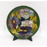 Moorcroft pottery 'Hibiscus' pattern green ground plate, impressed Moorcroft, made in England and