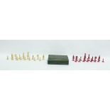 Eastern rectangular inlaid hinged box enclosing a chess set of pink and cream coloured pieces