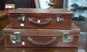 Two brown leather suitcases