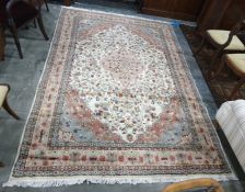 Eastern rug cream ground field with pink ground central medallion, allover foliate decoration,