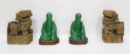 Pair of Asian carved wood Dogs of Fo modelled with their front paws with a ball or a mythical beast,