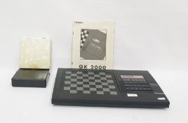 A Kasparov GK2000 electronic chess set, with board and chess pieces and a simulated mother of