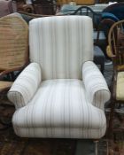 Multi York cream ground armchair on turned front supports, to brass castors