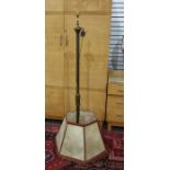 Brass bodied standard lamp with reeded column, circular base and three paw feet