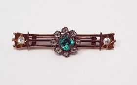 Antique gold-coloured metal, emerald and diamond bar brooch, the open triple bar set to the ends