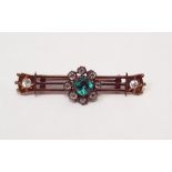 Antique gold-coloured metal, emerald and diamond bar brooch, the open triple bar set to the ends