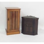 Oak wall hanging corner cupboard with single panelled door together with a single door pot