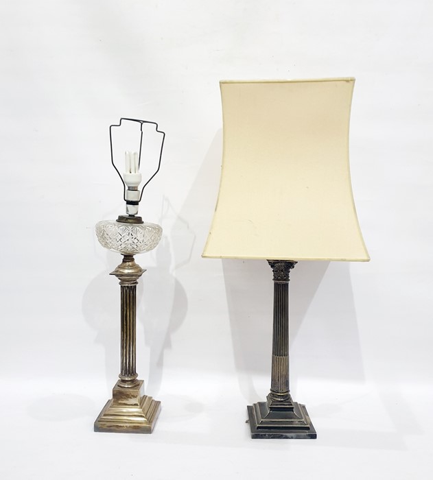 Two silver plated lamp bases formed as a Corinthium column and an ionic column, on stepped bases,