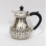 Late Victorian silver hot water jug with hinged cover, repousse foliate decoration, by Z Barraclough
