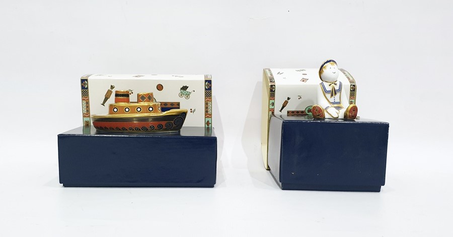 Two Royal Crown Derby "Treasures of Childhood" paperweights, comprising a model of a tug boat,