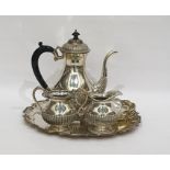 White metal coffee set comprising coffee pot, milk jug, sucriere, two dishes and a circular tray