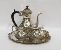 White metal coffee set comprising coffee pot, milk jug, sucriere, two dishes and a circular tray