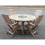 Teak circular garden table and six folding garden chairs and a dog cage