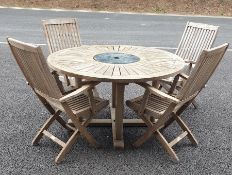 Teak circular garden table and six folding garden chairs and a dog cage