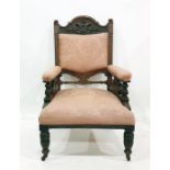 Two Victorian salon chairs, arched top rails with moulded decoration pink upholstered back and arm