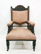 Two Victorian salon chairs, arched top rails with moulded decoration pink upholstered back and arm