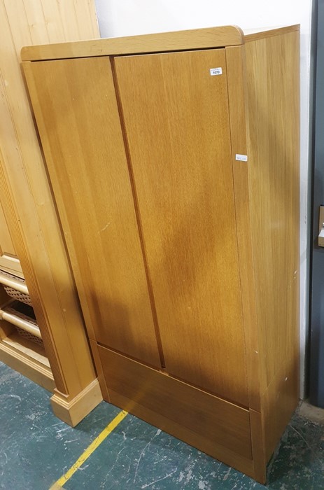 20th century oak wardrobe, the two doors above a single drawer, raised on plinth base 91 x 175cm