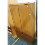 20th century oak wardrobe, the two doors above a single drawer, raised on plinth base 91 x 175cm