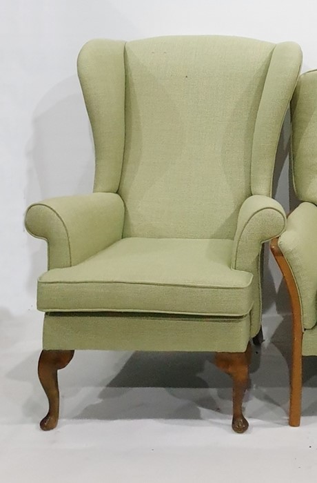 Wingback chair on cabriole supports in green upholstery