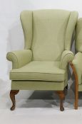 Wingback chair on cabriole supports in green upholstery