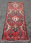 Eastern rug , central field with decorative floral panels, stepped border 248 x 105 cms