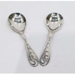 Pair Danish silver spoons with foliate and pierced handles, hammered bowls, possibly Georg Jensen (