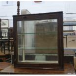 Mahogany table top display cabinet, three sided, single glazed door enclosing shelves, on plinth