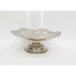 Silver fruit dish with pierced vine leaf decoration, on a raised circular foot, Sheffield 1928, 28cm