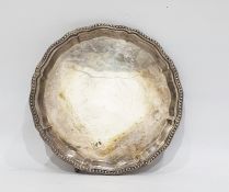 Silver salver with beaded wavy edge, raised on claw and ball feet, Sheffield 1996, diameter 20.