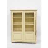 Cream painted food cupboard, the wire grill fronted doors enclosing shelves 84 x 108.5