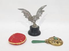 White metal sculpture of an eagle, on ebonised circular plinth, together with a gilt metal, stone