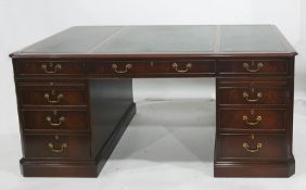 Twentieth century mahogany desk, rectangular top with green leather inset, nine assorted  drawers