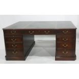Twentieth century mahogany desk, rectangular top with green leather inset, nine assorted  drawers