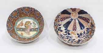 Two Asian porcelain bowls, the first decorated in the Imari palette, of fluted form, painted with