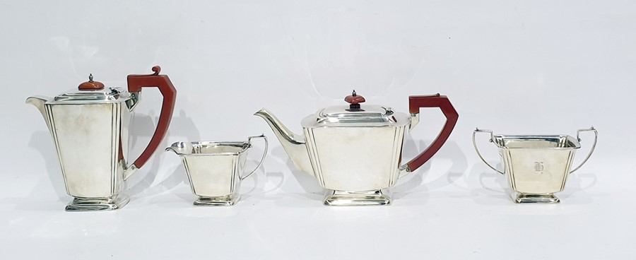 George V silver four-piece tea set of Art Deco design with bakelite finials and handles,