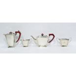 George V silver four-piece tea set of Art Deco design with bakelite finials and handles,