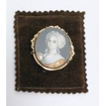 Gilt metal and miniature portrait brooch, the head and shoulders portrait of Georgian lady on