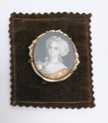 Gilt metal and miniature portrait brooch, the head and shoulders portrait of Georgian lady on