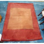Modern orange and red ground rug 167 x  237 cms