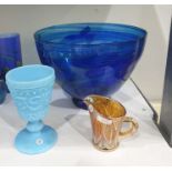 Blue tinted press-moulded glass goblet, 14cm high and a modern glass footed bowl of blue tint,