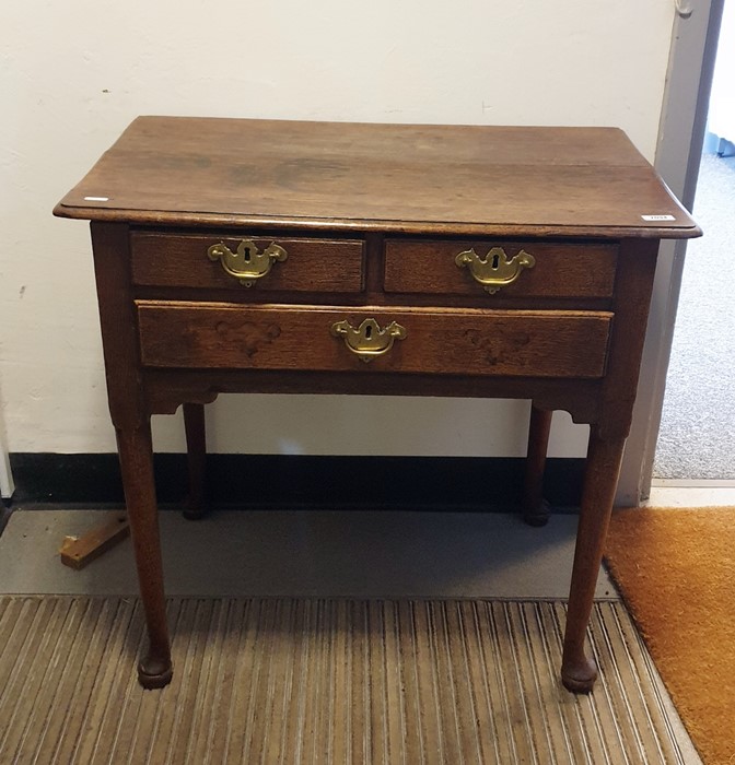 18th century oak lowboy, the rectangular top with moulded edge above two short and one long