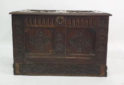 Possibly 18th century oak coffer with applied moulded decoration to the top, carved to twin panels