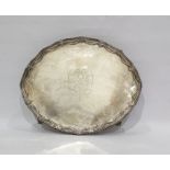Silver oval tray with swagged border and raised upon four claw and ball feet, London 1779,