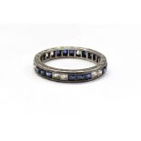 White metal baguette white stone and blue stone full eternity ring set with groups of three square